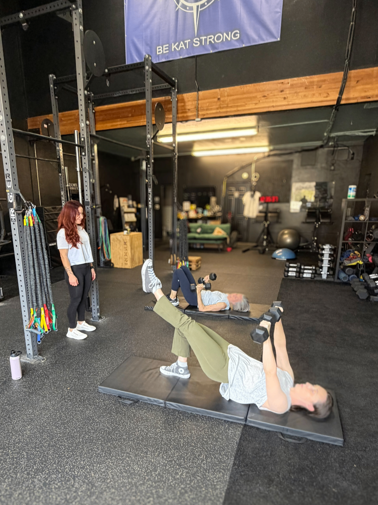 Inside BKS Central — clients training with a coach at Be Kat Strong's San Diego studio